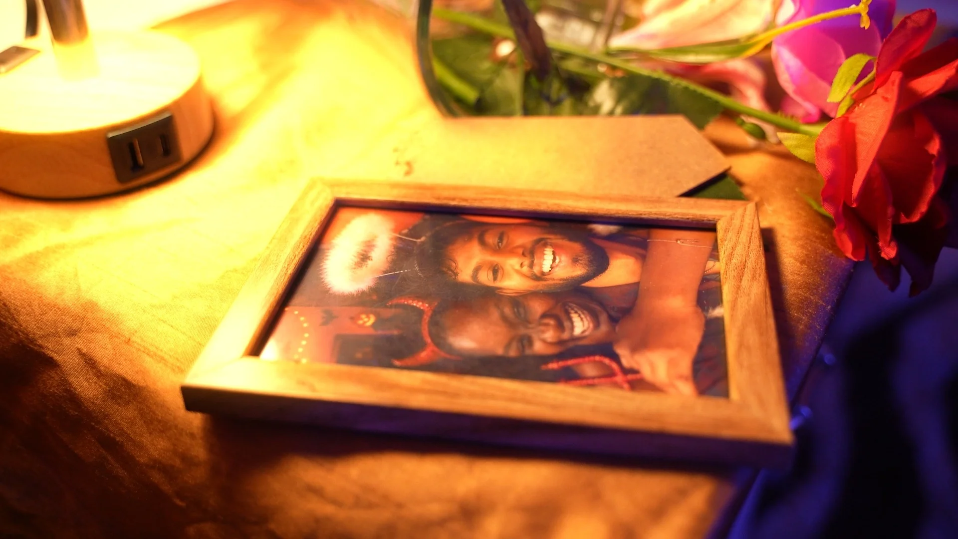 A framed family photograph in warm light from a ZAI Films production